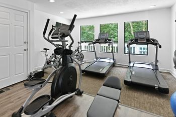 the gym at the district flats apartments in lenexa